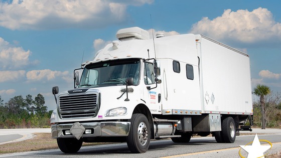 Landstar expedited box truck on the highway for time-critical freight
