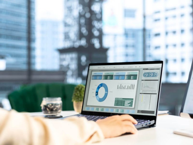 Freight analytics dashboard with charts and performance metrics on a laptop, representing shipment visibility and reporting
